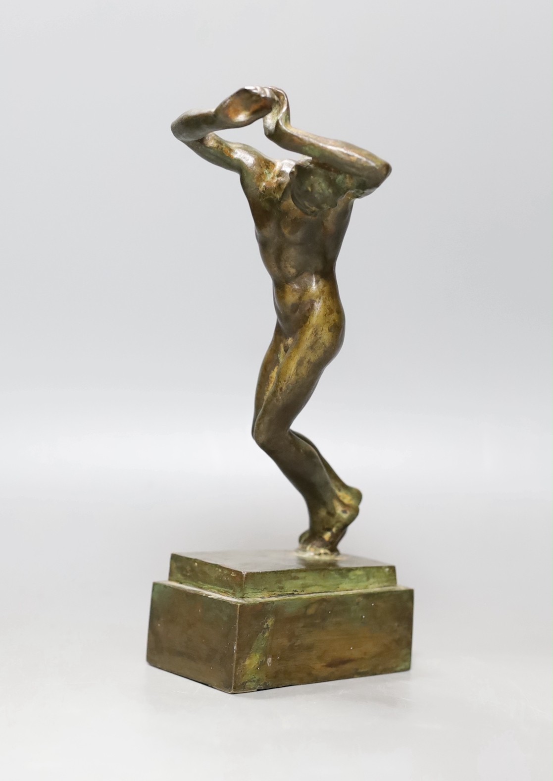 An Italian bronze figure of a nude man in dancing stance - 22cm tall